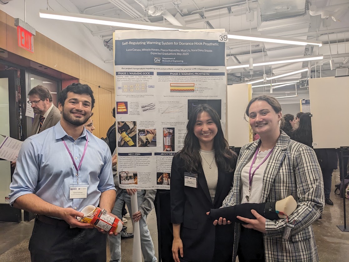 Students from the award-winning team standing in front of their research poster.
