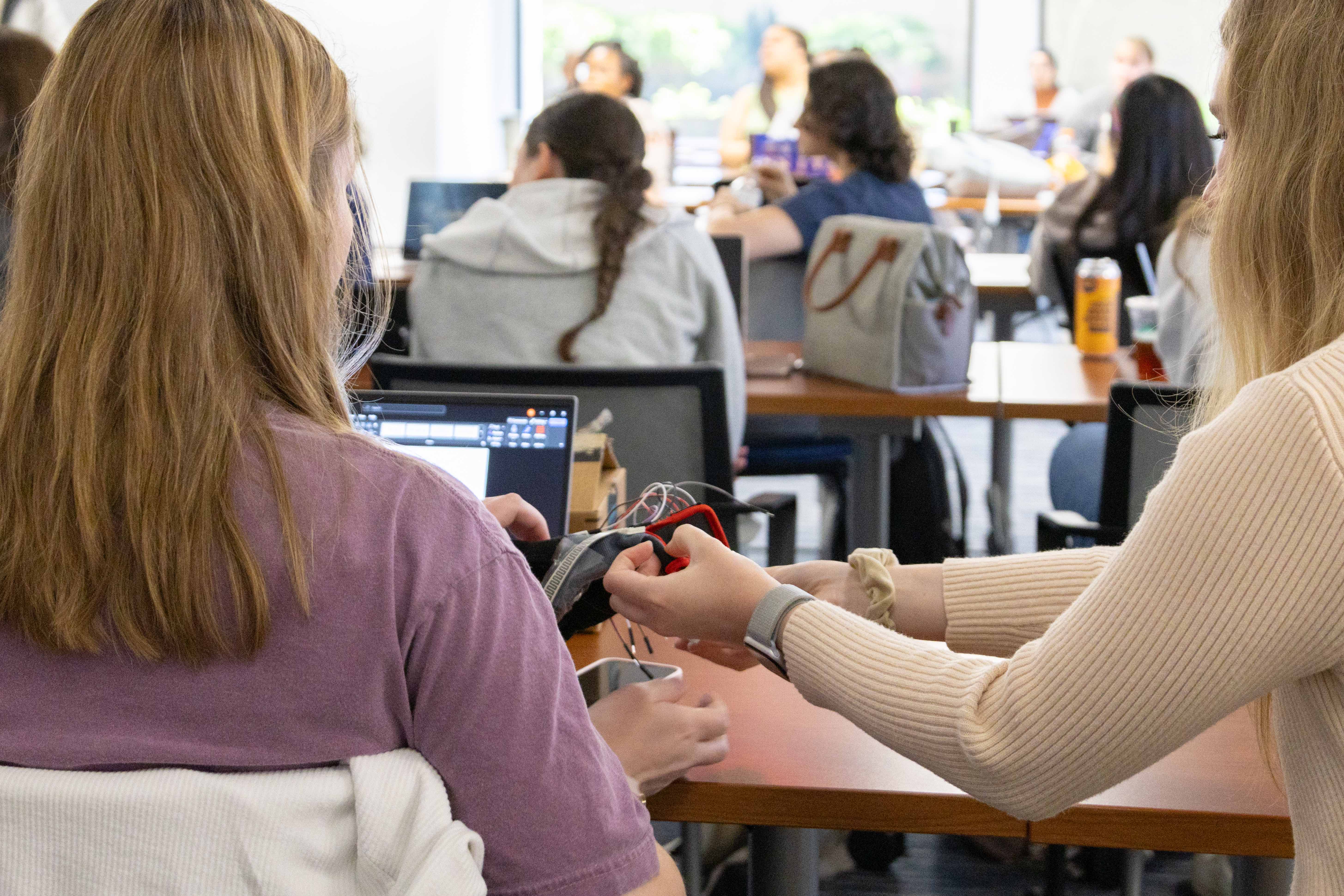Students working on a project at a table