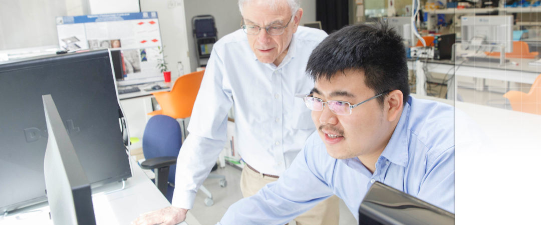 student and professor working in a lab