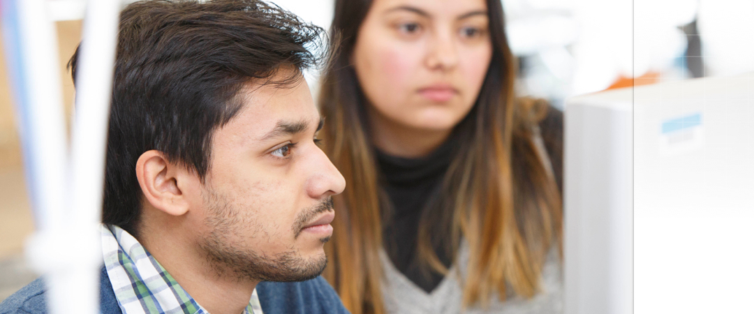 two students working at a computer