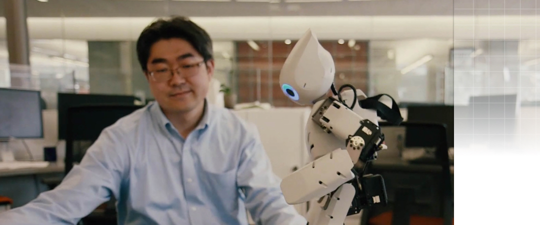 Professor Park watching robot