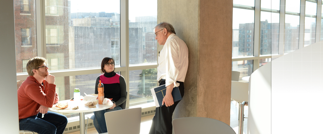 professor talking to two students