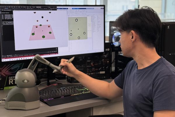 Student in front of a monitor working